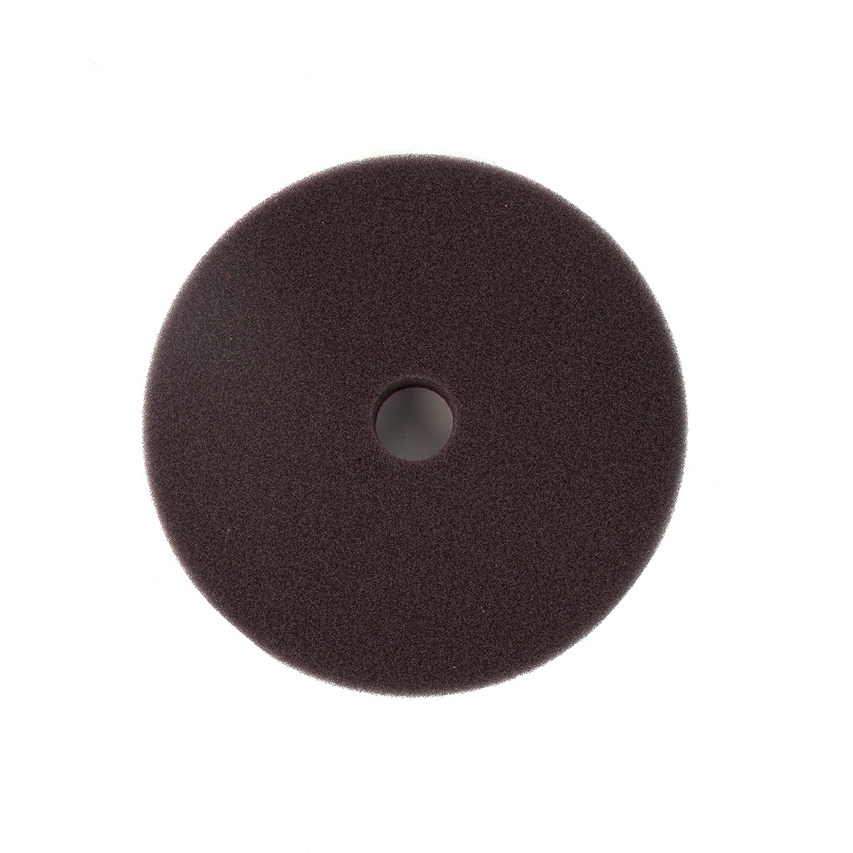 Round brown foam pad with central hole on a white background