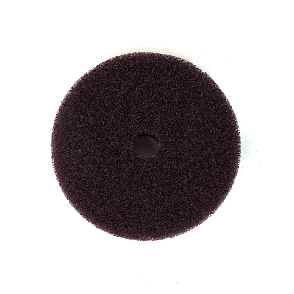 Round black foam pad on a white background