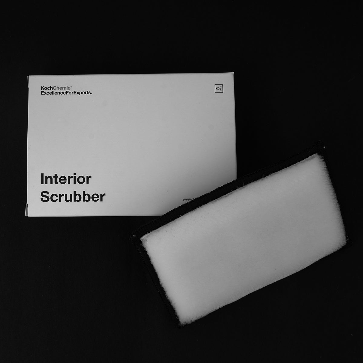 Interior scrubber with packaging on a black background