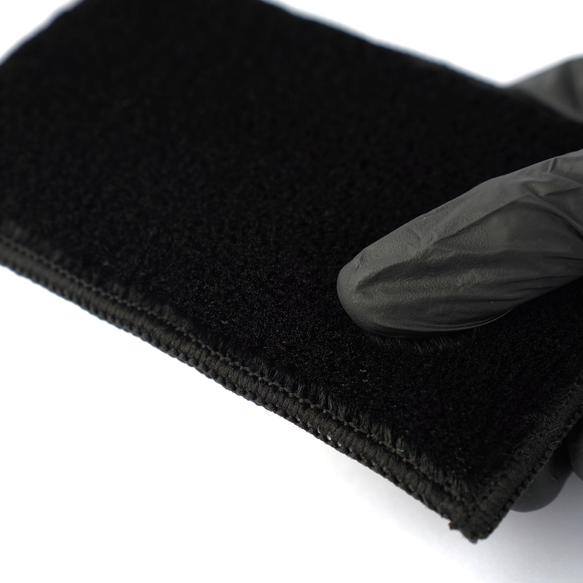 Black headband with a black glove on a white background