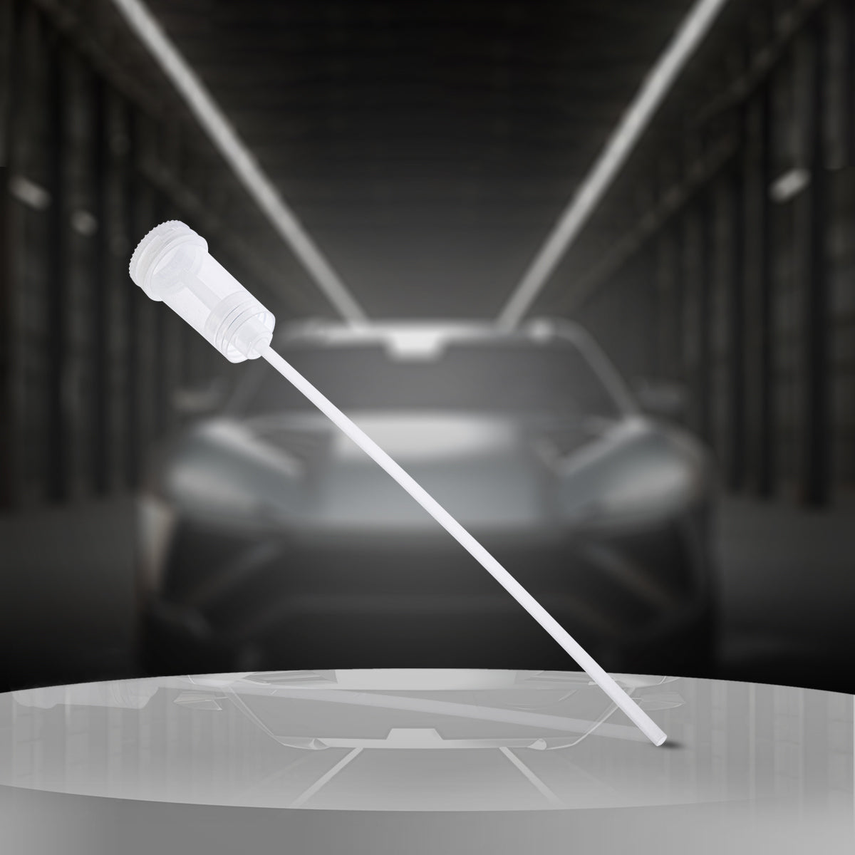 Car with a white light beam projected towards it, set against a dark background.