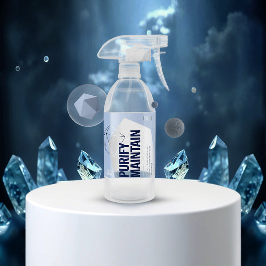 Spray bottle labeled 'Purify Maintain' with crystal-like designs on a dark background