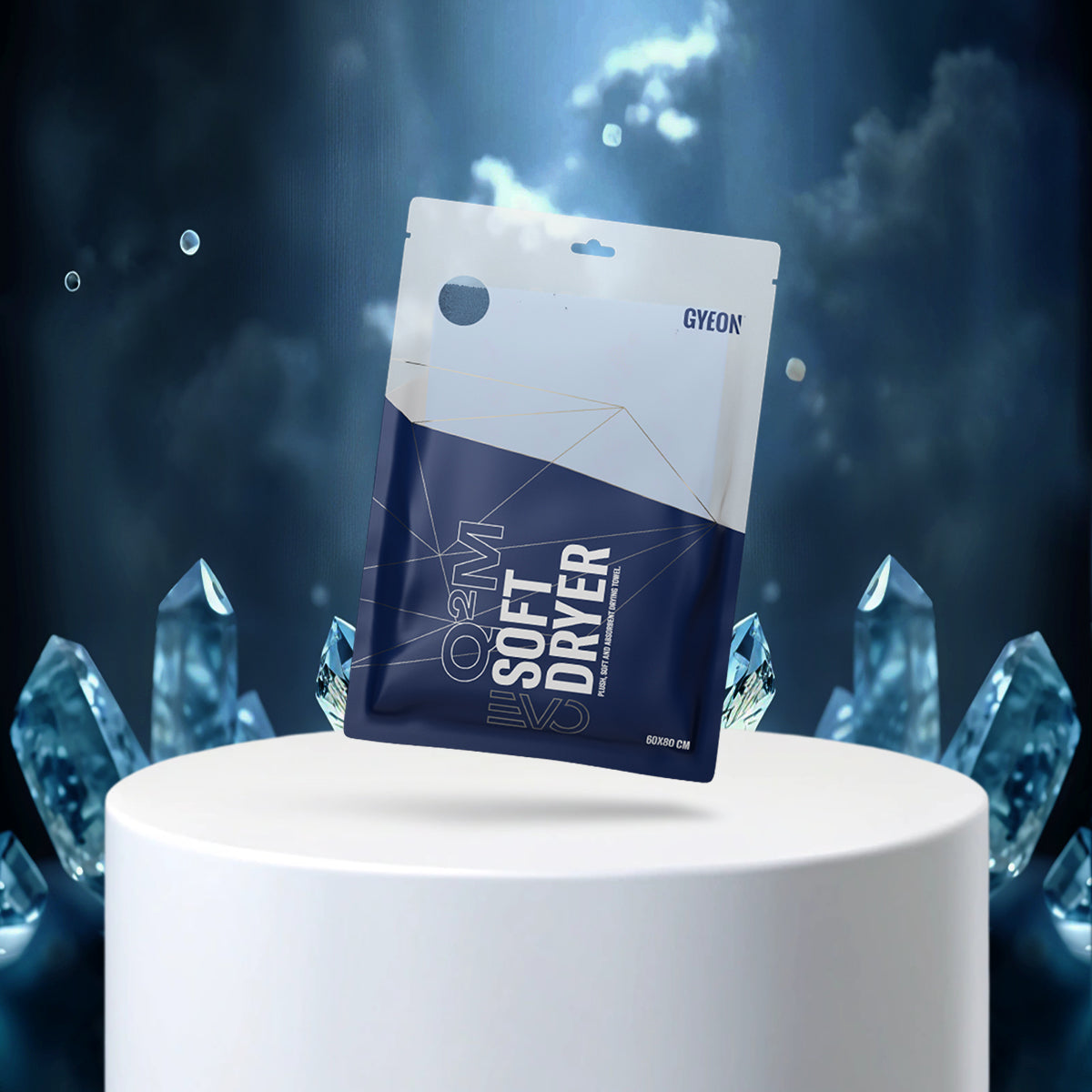 GYEON Soft Dryer packaging on a white pedestal with blue crystal-like structures in the background