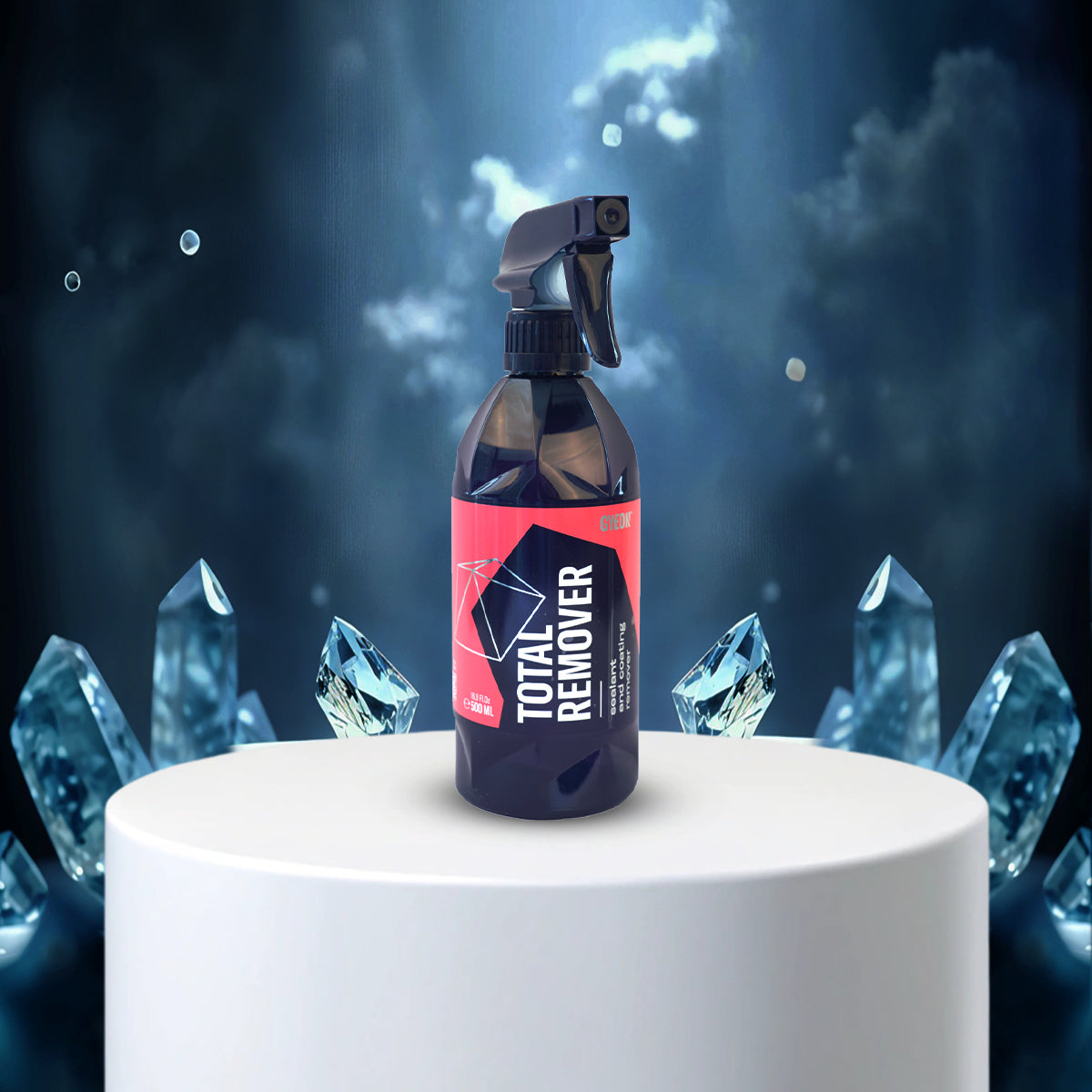 Bottle of 'Total Remover' with crystal-like shapes on a dark background