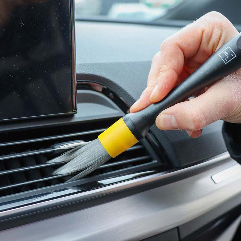 Red, yellow, and green brushes in the Koch Chemie Vikan Interior Brush Set, perfect for car detailing and fine work