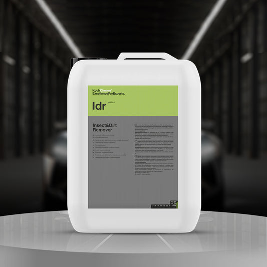 insect and dirt remover container on a reflective surface with a blurred background