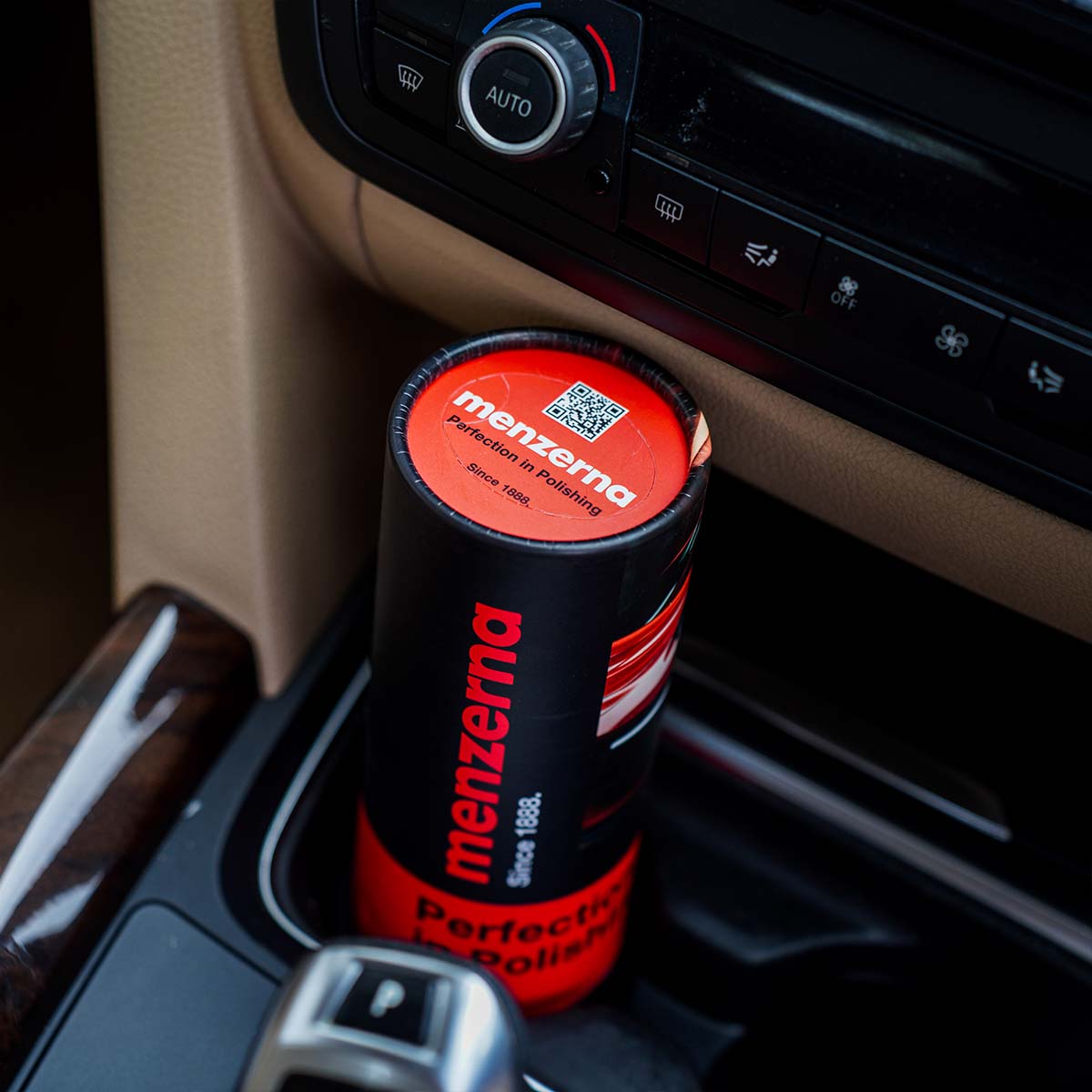 Compact Menzerna Tissue Tube with 50 soft tissues, perfect for keeping organized on the go.