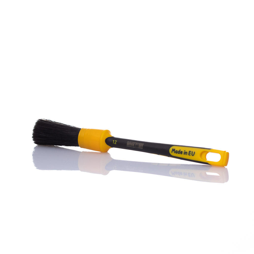 Black rubber-handled detailing brush with 24mm synthetic bristles, ideal for cleaning rims, engines, and car interiors without scratching.