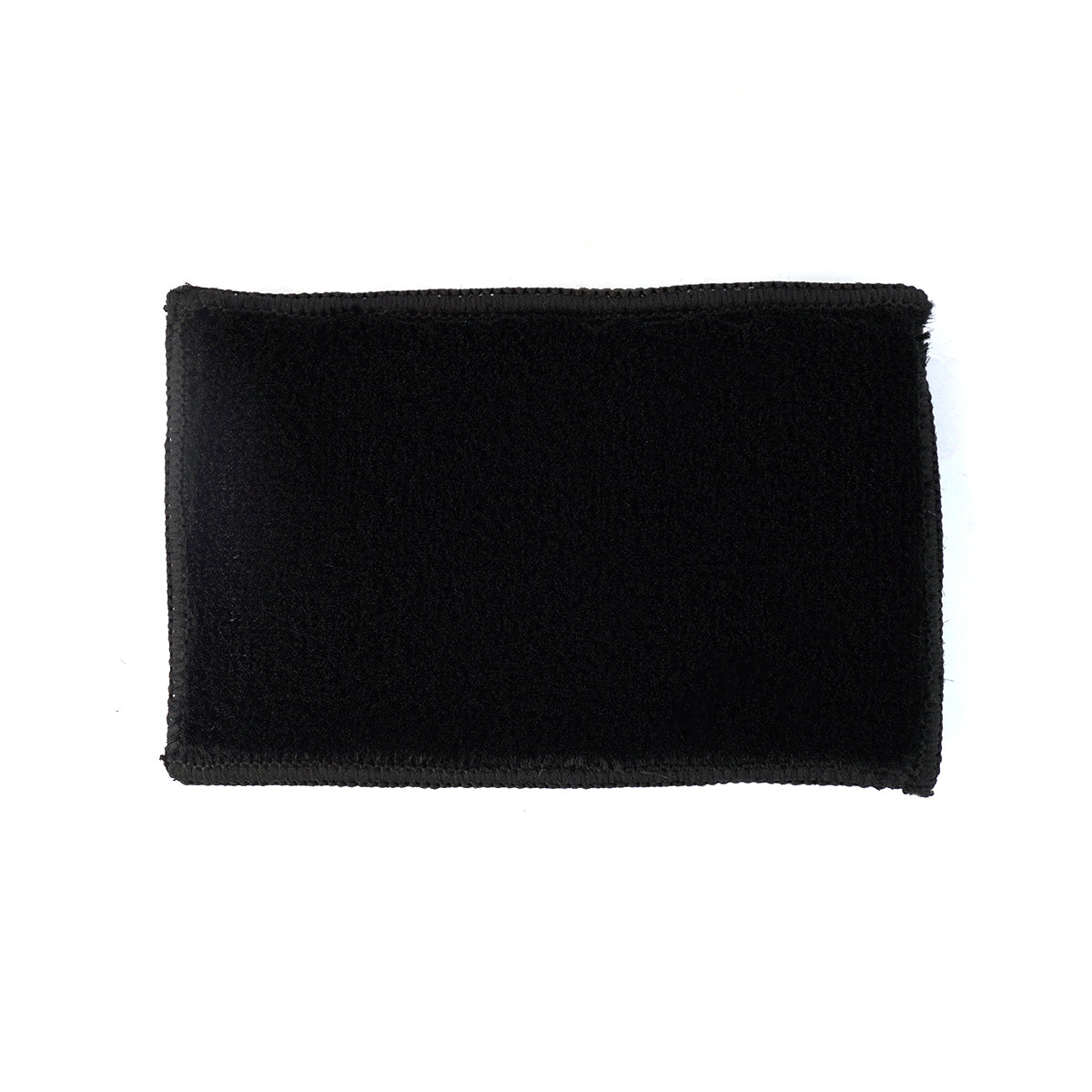 Black rectangular patch on a white background