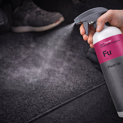 Koch Chemie Fresh Up 1Ltr Vehicle Air Fresheners spraying on car seat closeup