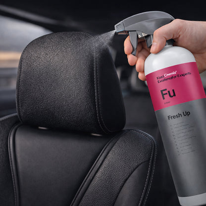 Koch Chemie Fresh Up 1Ltr Vehicle Air Fresheners spraying on car seat top portion