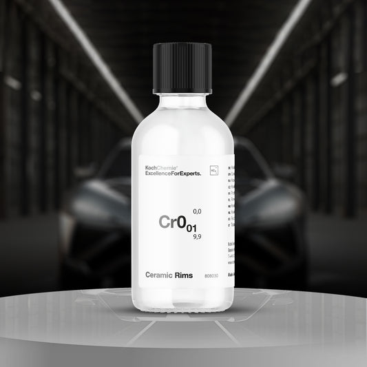 Bottle labeled 'CrO01' on a reflective surface with a blurred car in the background
