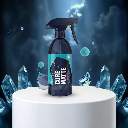 Cure Matte' on a white pedestal with crystal-like shapes in the background