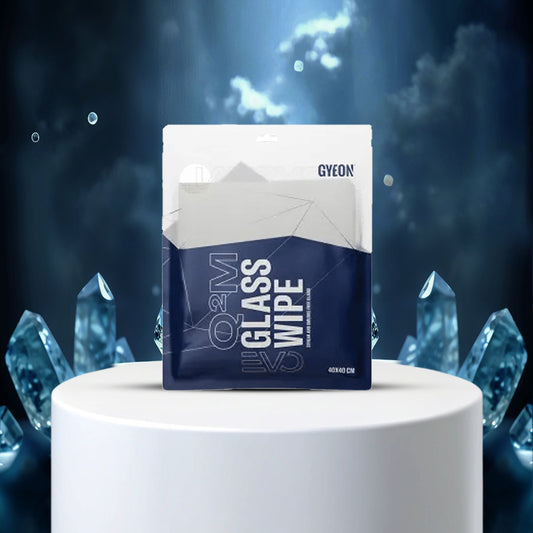 Gyeon glass wipe packaging on a white pedestal with crystal-like decorations
