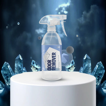 Spray bottle labeled with crystal-like structures on a dark background