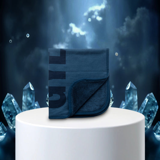 Blue wallet with brand logo on a white pedestal against a mystical blue background with crystals.