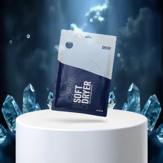 GYEON Soft Dryer packaging on a white pedestal with blue crystal-like structures in the background