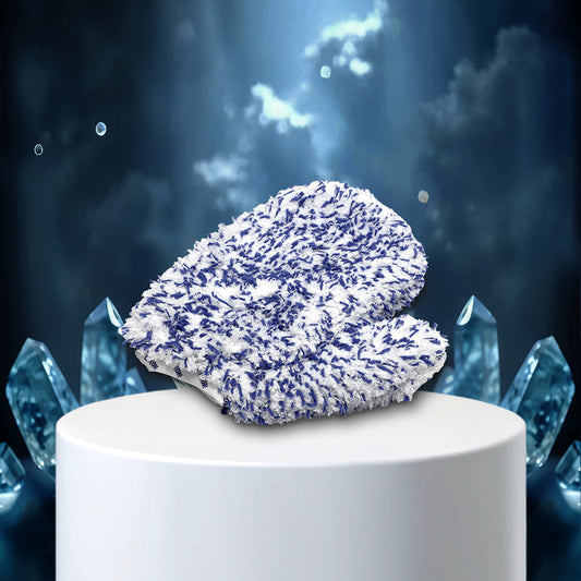 Blue and white textured wheel mitt on a white pedestal with crystal-like structures in the background