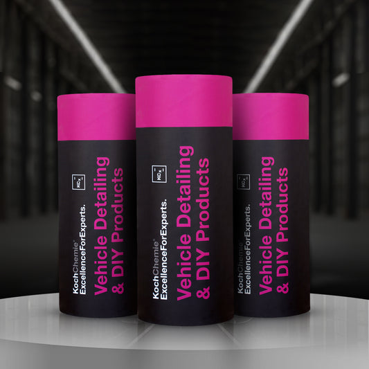 Three tubes of Koch Chemie car tissue with pink caps and black body, placed against a dark background with reflective floor.
