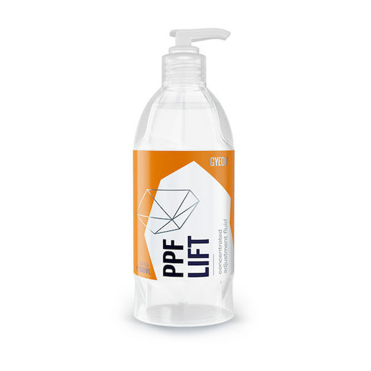 Clear bottle with orange and white label on a white background