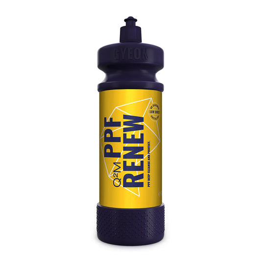 Bottle with yellow label and black cap on a white background