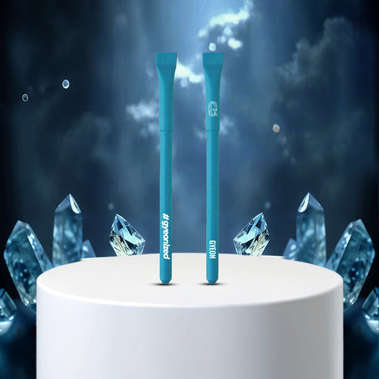 Two blue pens on a white pedestal with crystal-like structures against a dark, starry background.