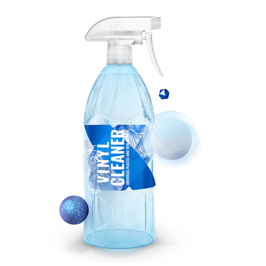 Spray bottle labeled 'Vinyl Cleaner' with blue liquid on a white background