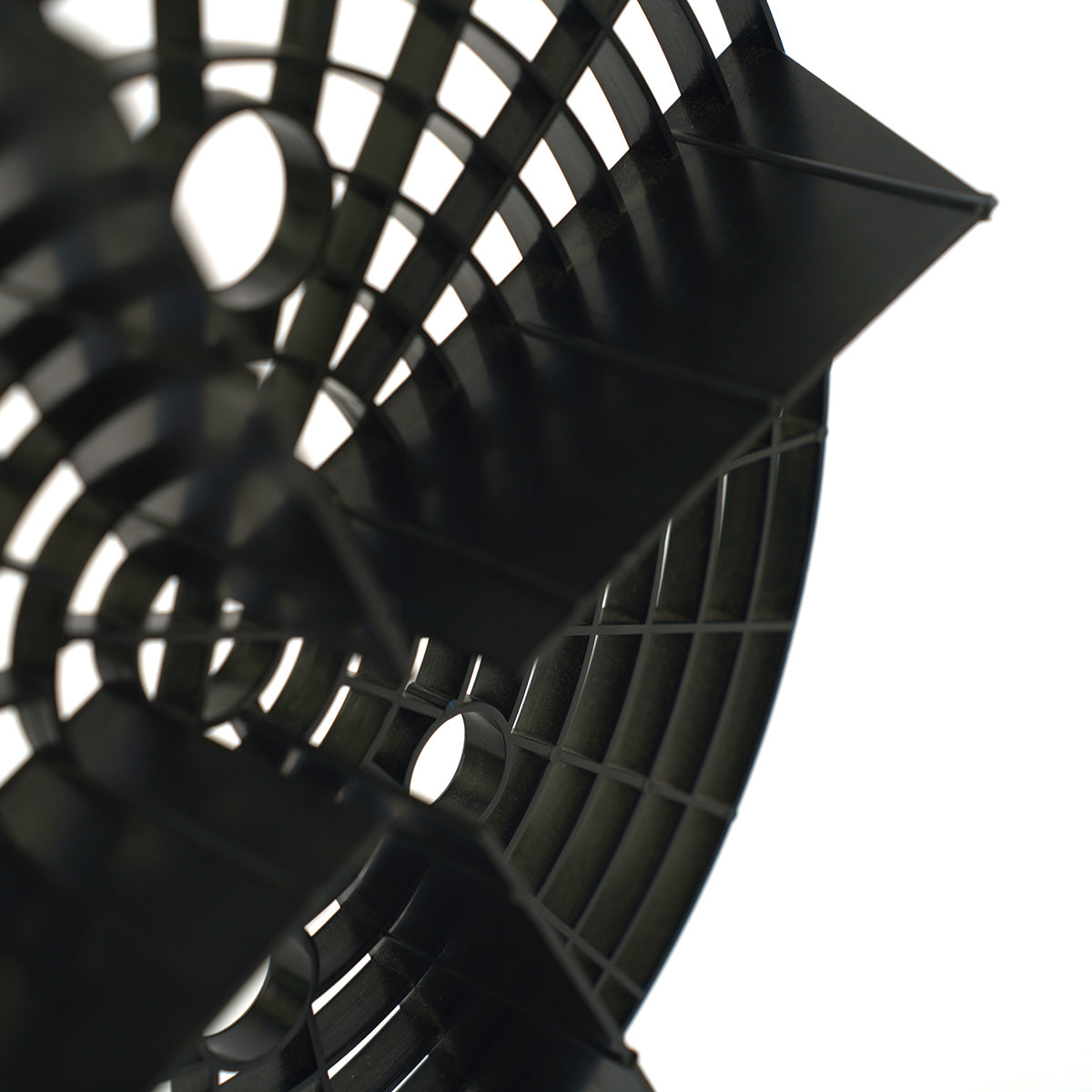 Close-up of a black fan blade on a white background