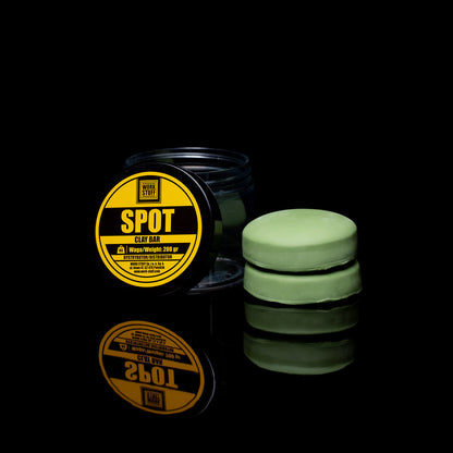 Green clay bar with a yellow label on a black background